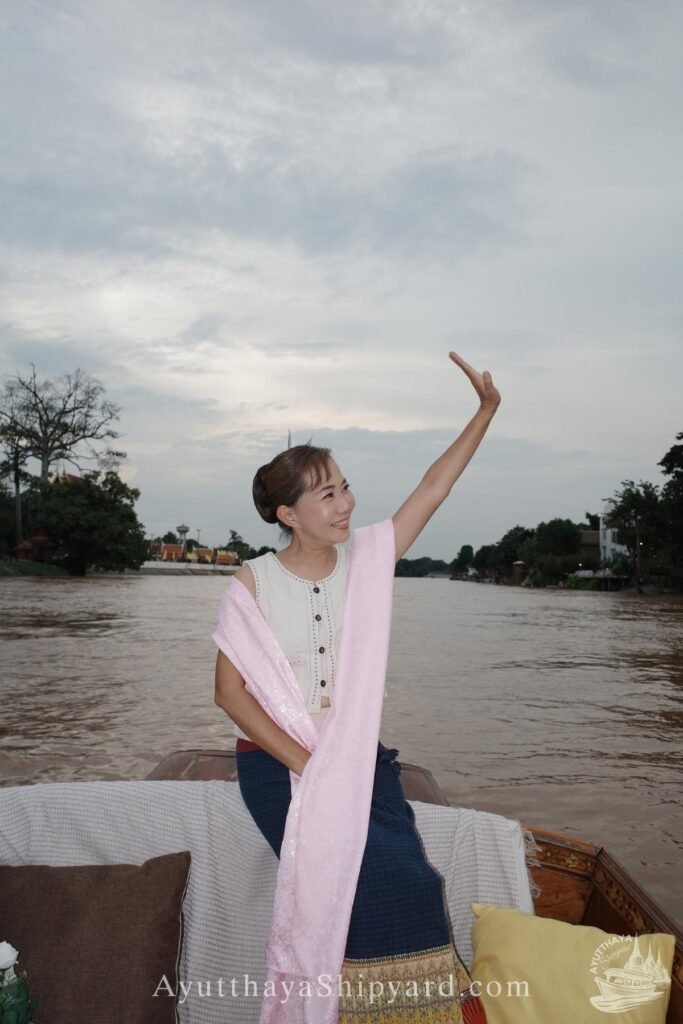 Discover Ayutthaya by River: A Cultural Cruise Experience Ayutthaya boat tour, Thai traditional dress, Chao Phraya River, temple view, Ayutthaya photography